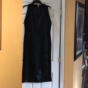 Midi length dress. Faux leather front and back panels. Knit side panels